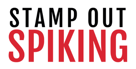 A rectangular sign with the text "STAMP OUT SPIKING"; "SPIKING" is in bold red letters, and the rest of the text is in black.